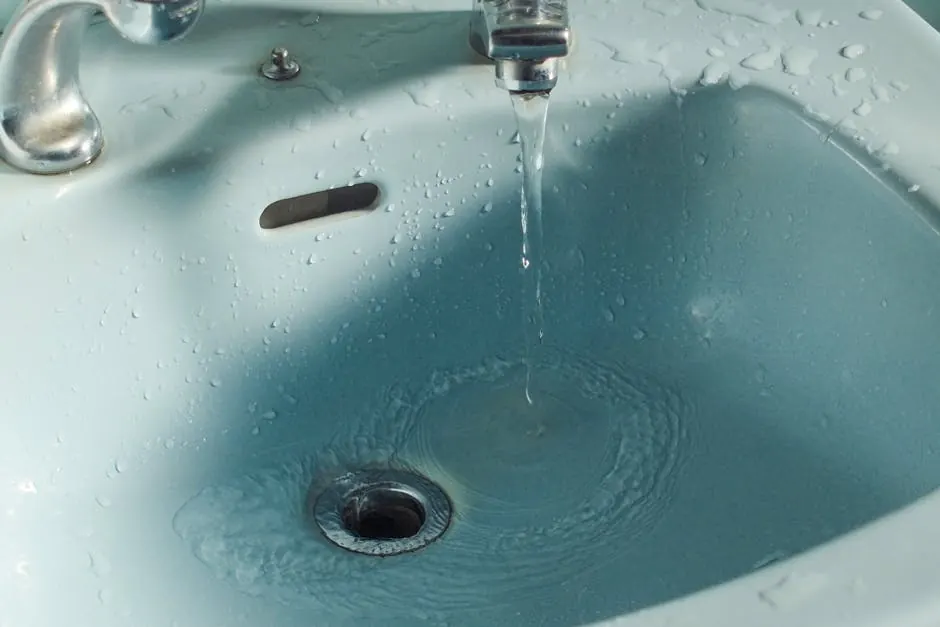 Water flowing into a bathroom sink drain